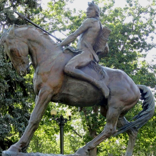 Statue of American Indian riding a horse