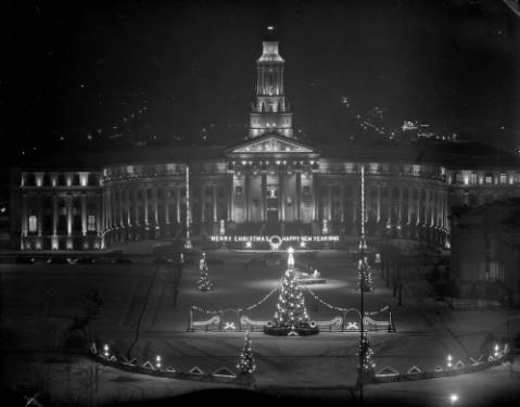 The Denver City and County Building is decorated for Christmas, Denver, Colorado. Sign reads: "Merry Christmas Happy New Year 1940." (1940)